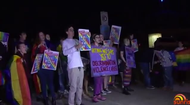 Angry rival protesters clashed outside a Brisbane church, resulting in one woman being arrested. Photo: 7 News