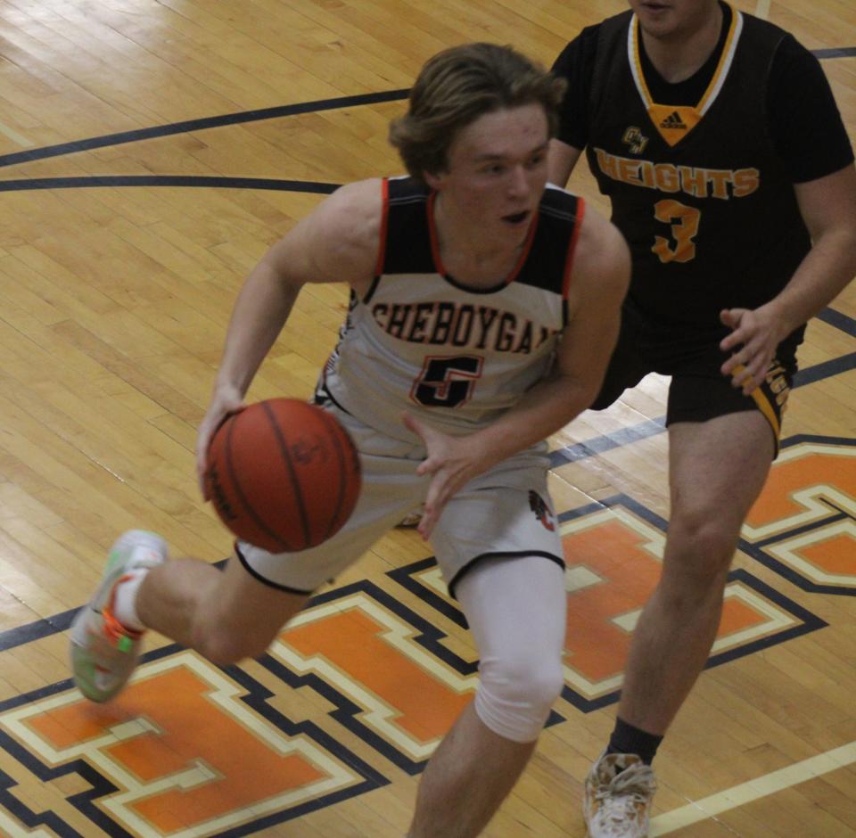 Cheboygan junior Caden Gardner (5) drives to the basket during the first half against Ogemaw on Tuesday.