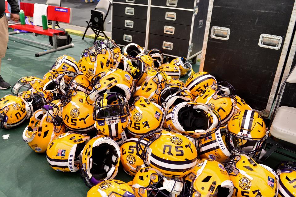 The LSU Tigers football team is now in the crosshairs of the NCAA after a report of a booster paying $180,000 to a player's father. (Photo Credit: USAT)