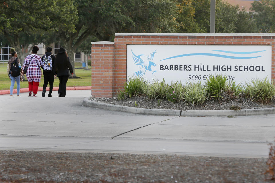 From left, an unidentified female, mother Darresha George, Darryl George, and Candice Matthews, National minister of politics for the New Black Panther Nation, walk to Barbers Hill High School after Darryl served a 5-day in-school suspension for not cutting his hair Monday, Sept. 18, 2023, in Mont Belvieu. (AP Photo/Michael Wyke)