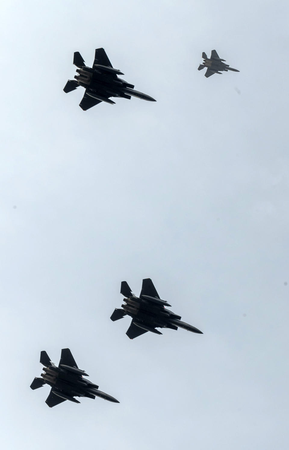 F-15 planes seen from Endcliffe Park in Sheffield, as warplanes from Britain and the United States stage a flypast tribute to Tony Foulds, and ten dead US airmen, 75-years after Foulds witnessed the crash that killed them. Foulds was just a child playing in the park on Feb. 22, 1944, when a U.S. Air Force crew decided to crash and die rather than take the chance of hitting the playing children. For decades Foulds has tended a memorial dedicated to honouring the 10 U.S. airmen who died in the plane crash at Endcliffe Park, and today the flypast fulfils his wish for the men who saved his life. (Danny Lawson/PA via AP)