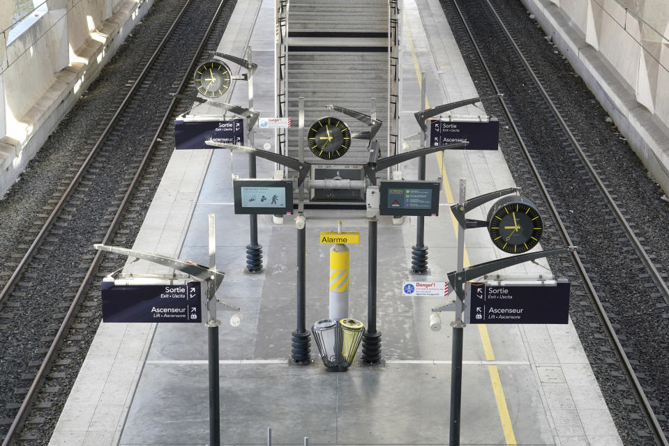 A view of an empty train station at the Lyon Saint-Exupery airport, central France, during the lockdown in an effort to control the spread of coronavirus, Wednesday, April 1, 2020. French citizens are only allowed to leave their homes for necessary activities such as shopping for food, going to work or taking a quick walk due to the rapid spreading of the new coronavirus in the country. (AP Photo/Laurent Cipriani)