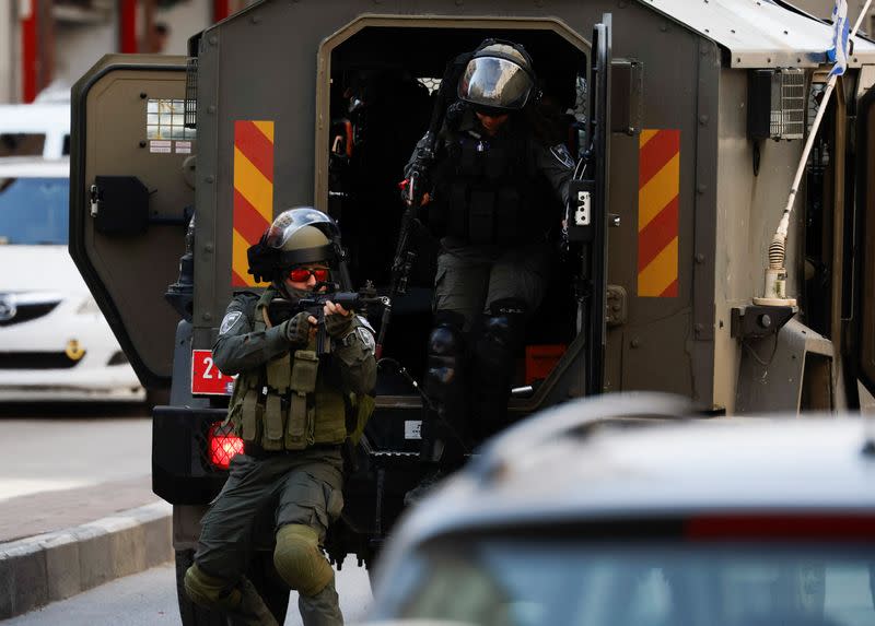 Israeli troops raid the houses of Palestinians believed to be assailants, in the West Bank