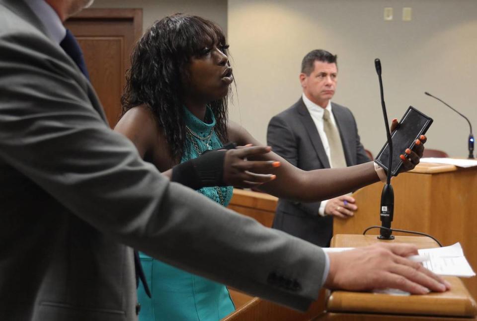 Dyma Loving, right, who was tackled by former Miami-Dade cop Alejandro Giraldo, gives her statement prior to the sentencing of Giraldo in court at the Richard E. Gerstein Justice Building in Miami.