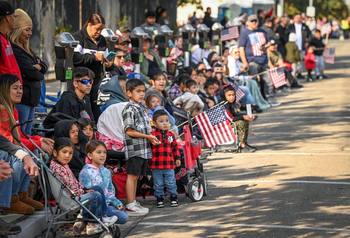 Crowds of people line the route during the annual Veterans Parade in downtown Fresno on Friday, Nov. 11, 2022. CRAIG KOHLRUSS/ckohlruss@fresnobee.com