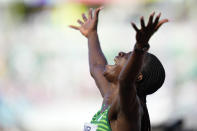 Tobi Amusan, of Nigeria, reacts after winning the women's 100-meter hurdles semifinal at the World Athletics Championships on Sunday, July 24, 2022, in Eugene, Ore. (AP Photo/Ashley Landis)