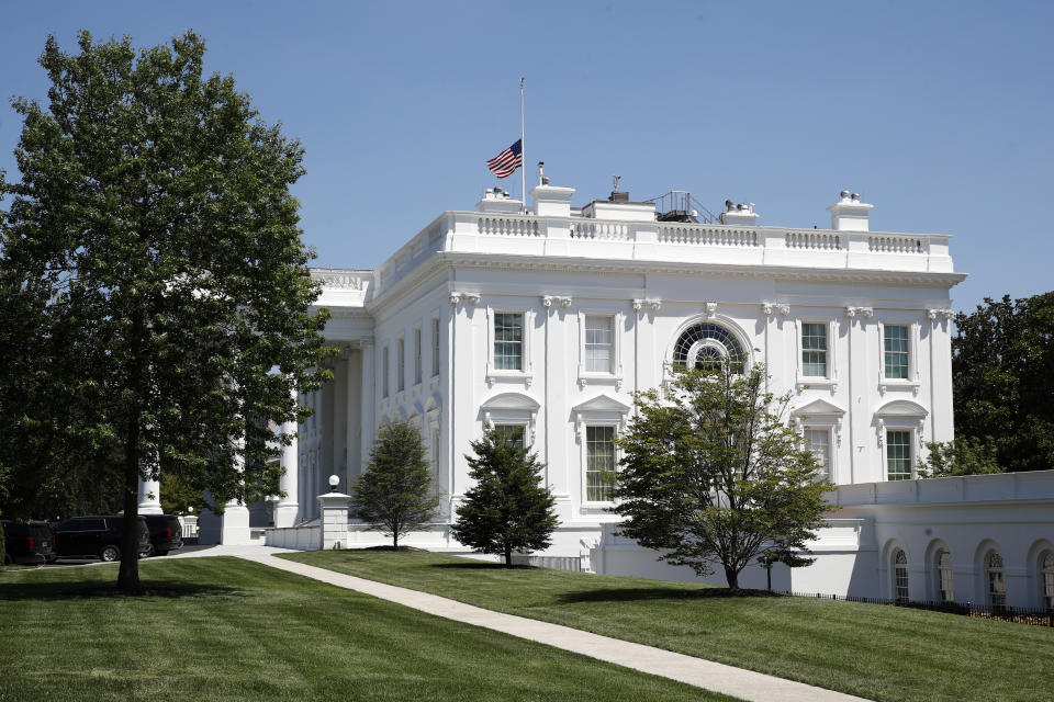 An American flag flies at half-staff over the White House in Washington, Saturday, July 18, 2020, in remembrance of Rep. John Lewis, D-Ga. Lewis, who carried the struggle against racial discrimination from Southern battlegrounds of the 1960s to the halls of Congress, died Friday. (AP Photo/Patrick Semansky)