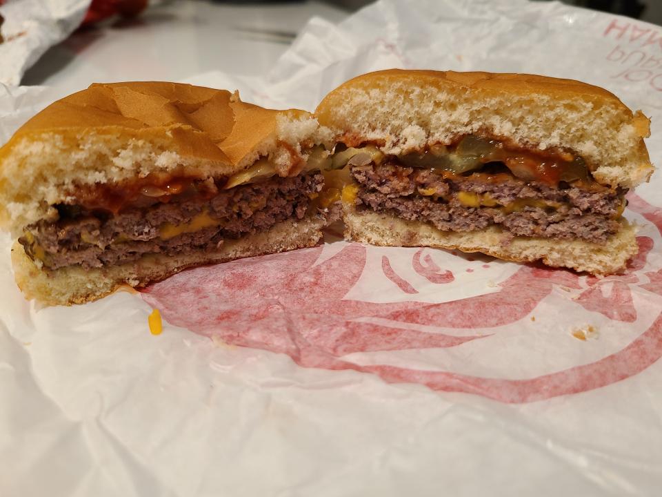wendys double stack cut open on red-and-white wrapper