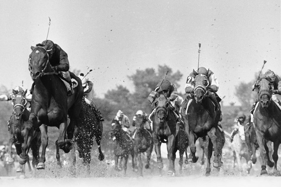 FILE - Canonero II, foreground, left, with jockey Gustavo Avila up, races to victory in the 97th Kentucky Derby on May 1, 1971, in Louisville, Ky. Lost in the big picture of several horse deaths and multiple scratches leading up to the Kentucky Derby was the story of winner Mage’s unique connections. He’s the first Derby champion with Venezuelan ties since Canonero II in 1971 and technically has 382 different owners. (AP Photo/File)