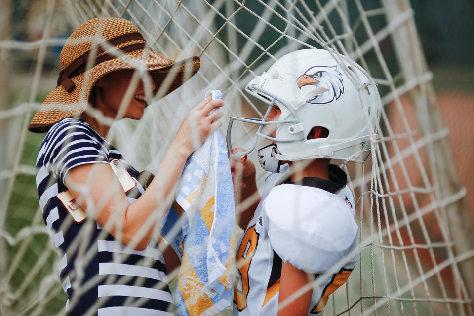 Woman wiping face of Eagles player