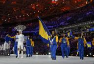 Bosnia and Herzegovina's flag-bearer Zana Novakovich leads her country's delegation during the opening ceremony of the 2014 Sochi Winter Olympic Games at Fisht stadium February 7, 2014. REUTERS/Brian Snyder (RUSSIA - Tags: OLYMPICS SPORT)