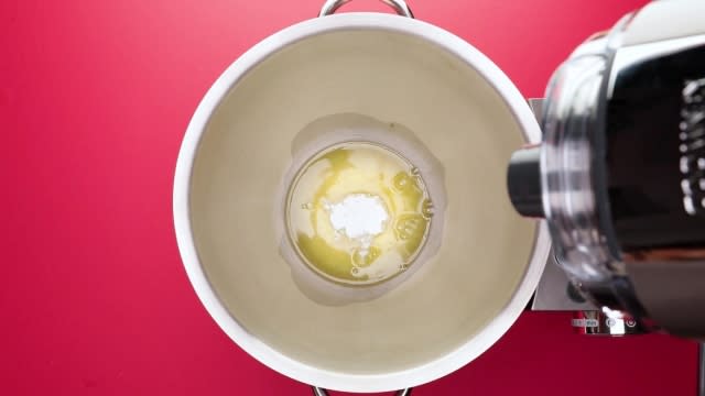 Egg whites and cream of tartar in mixing bowl