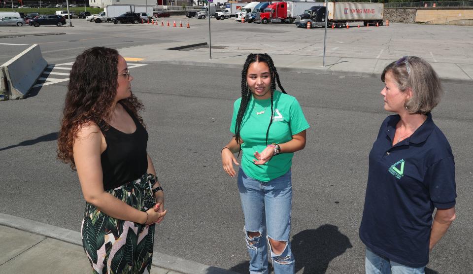 From left, Candida Rodriguez, with Groundwork Hudson Valley, Brianna Rodriguez, a recent Yonkers High graduate, and Brigitte Griswold, Groundwork Hudson Valley CEO, talk about the heat in the area of Getty Square in Yonkers July 1, 2022.   