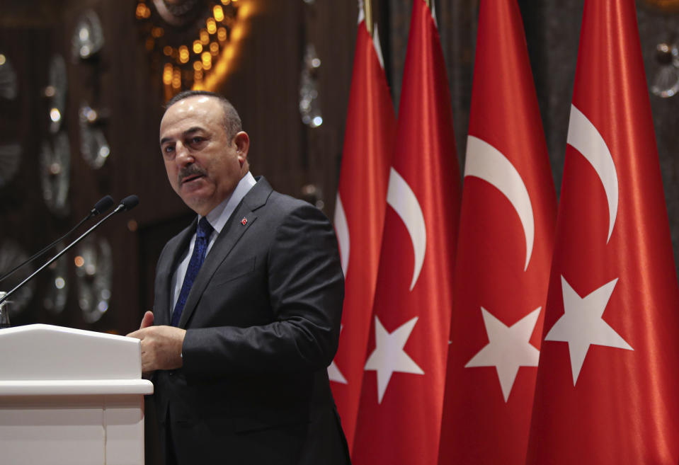 Turkish Foreign Minister Mevlut Cavusoglu speaks during a meeting in Ankara, Turkey, Tuesday, Feb. 4, 2020. Cavusoglu said Tuesday Ankara and Moscow were trying to keep peace efforts for Syria alive despite Syrian government advances and a deadly clash between Turkish and Syrian forces in northern Syria. (Turkish Foreign Ministry via AP, Pool)