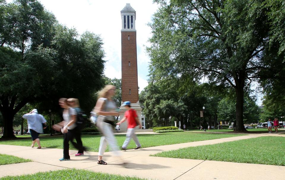 Students walk to and from classes in front of Denny Chimes on the Quad at the University of Alabama in Tuscaloosa.