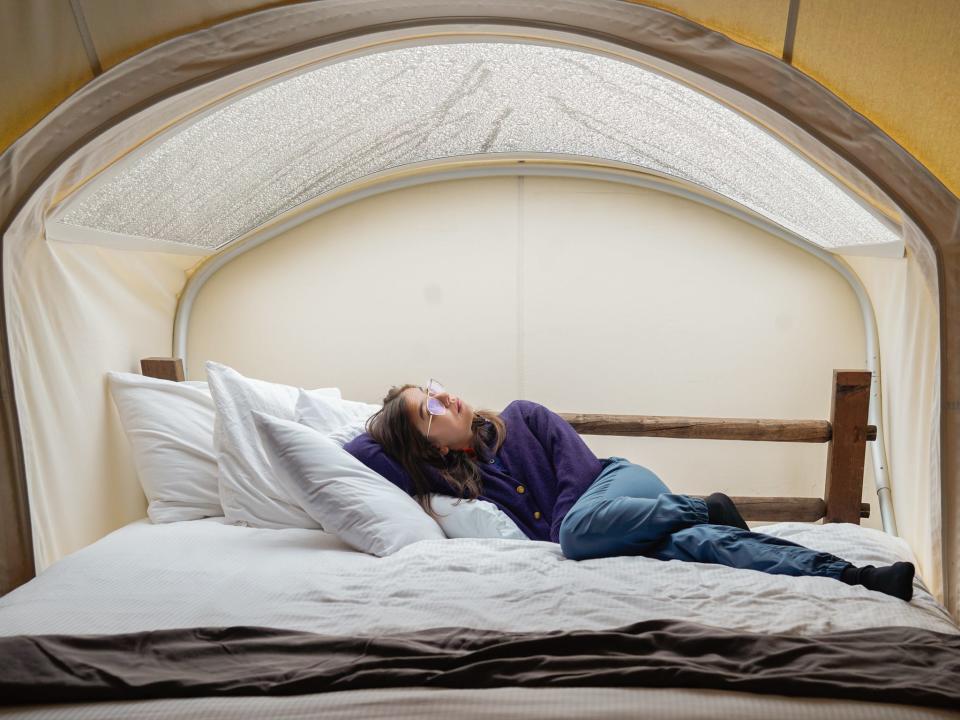 The author relaxes in her tent.