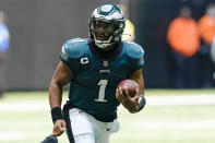 Philadelphia Eagles quarterback Jalen Hurts (1) runs put of the pocket against the Atlanta Falcons during the first half of an NFL football game, Sunday, Sept. 12, 2021, in Atlanta. (AP Photo/John Bazemore)