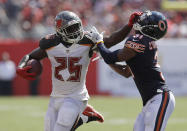 <p>Chicago Bears defensive back Marcus Cooper (31) attempts to stop Tampa Bay Buccaneers running back Peyton Barber (25), during the second half of an NFL football game, Sunday, Sept. 17, 2017, in Tampa, Fla. (AP Photo/Chris O’Meara) </p>