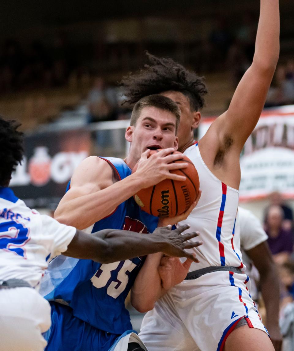 Junior All-Star Mason Jones (35) pushes past Indiana All-Star players on Wednesday, June 8, 2022, at Mt. Vernon High School in Fortville.