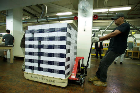 Workers prepare for delivery printed President Donald Trump's FY2018 budget at the Government Publishing Office in Washington, U.S., May 19, 2017. REUTERS/Yuri Gripas