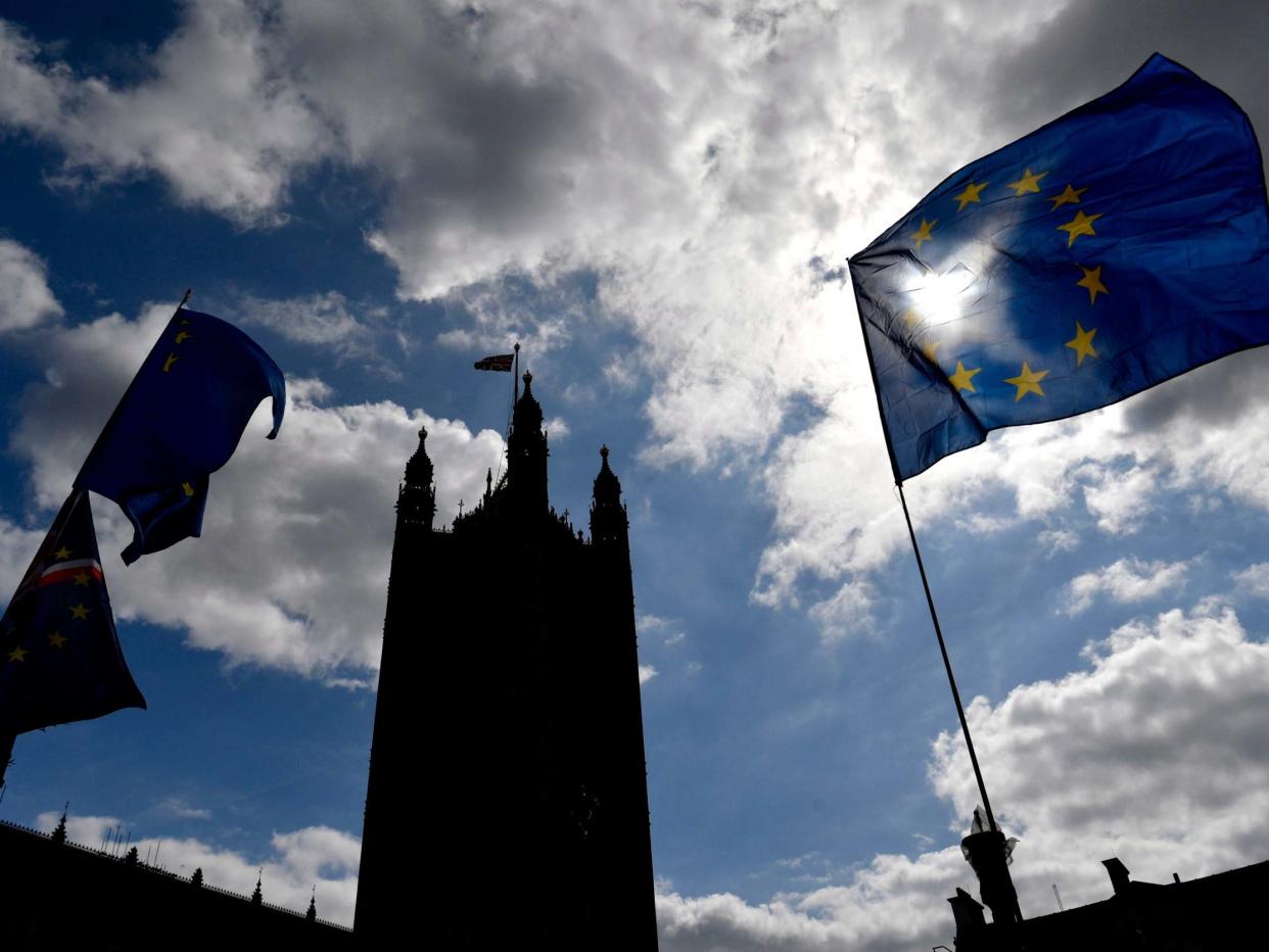 The EU flag flutters outside the British Houses of Parliament in central London: EPA