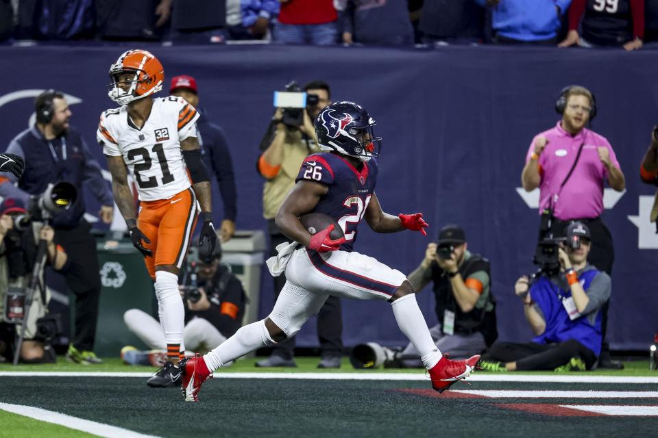 Jan 13, 2024; Houston, Texas, USA; Houston Texans running back Devin Singletary (26) scores a touchdown during the fourth quarter in a 2024 AFC wild card game at NRG Stadium. Mandatory Credit: Troy Taormina-USA TODAY Sports