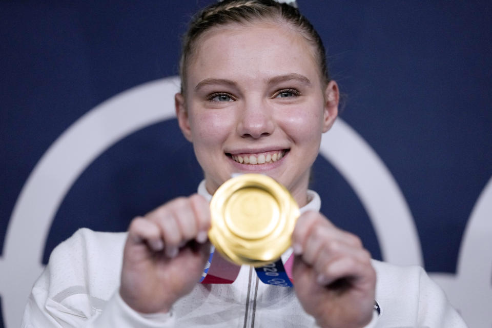 FILE - In this Aug. 2, 2021, file photo, Jade Carey, of the United States, poses after winning the gold medal for the floor exercise during the artistic gymnastics women's apparatus final at the 2020 Summer Olympics in Tokyo, Japan. Carey is finally embarking on her freshman year at Oregon State, after taking a somewhat winding route to Corvallis. Then again, the 21-year-old Olympic gold medalist is used to taking the non-traditional path. (AP Photo/Ashley Landis)