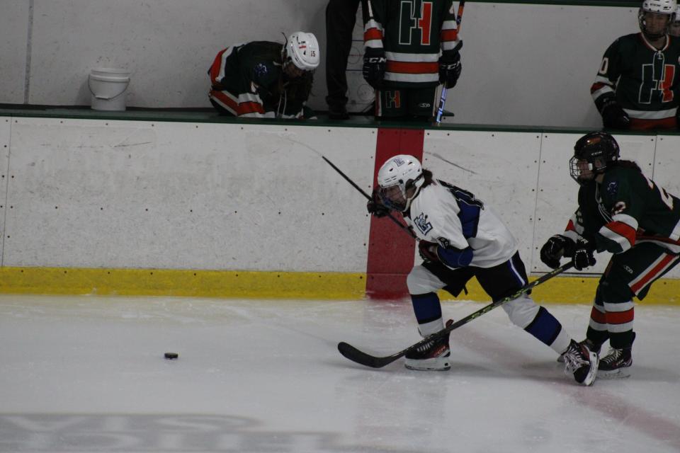 Rachel Simkewicz tries to get free from Hopkinton's Madalin Barroso in Leominster's home opener in Fitchburg on Dec. 11, 2023.