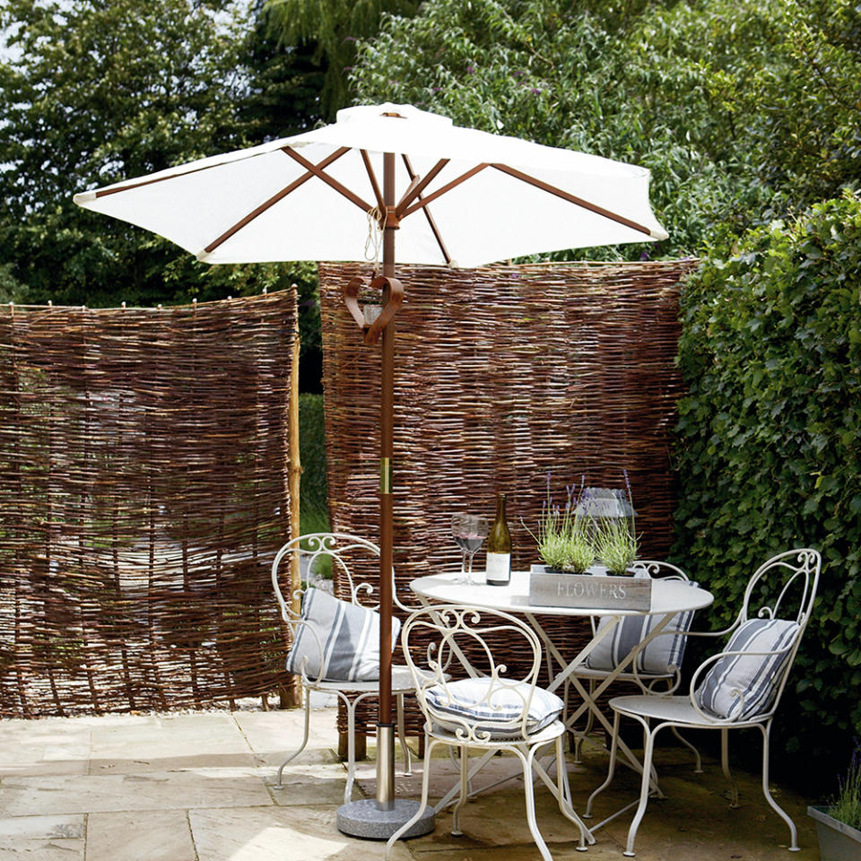 Create a secluded dining area with willow fencing