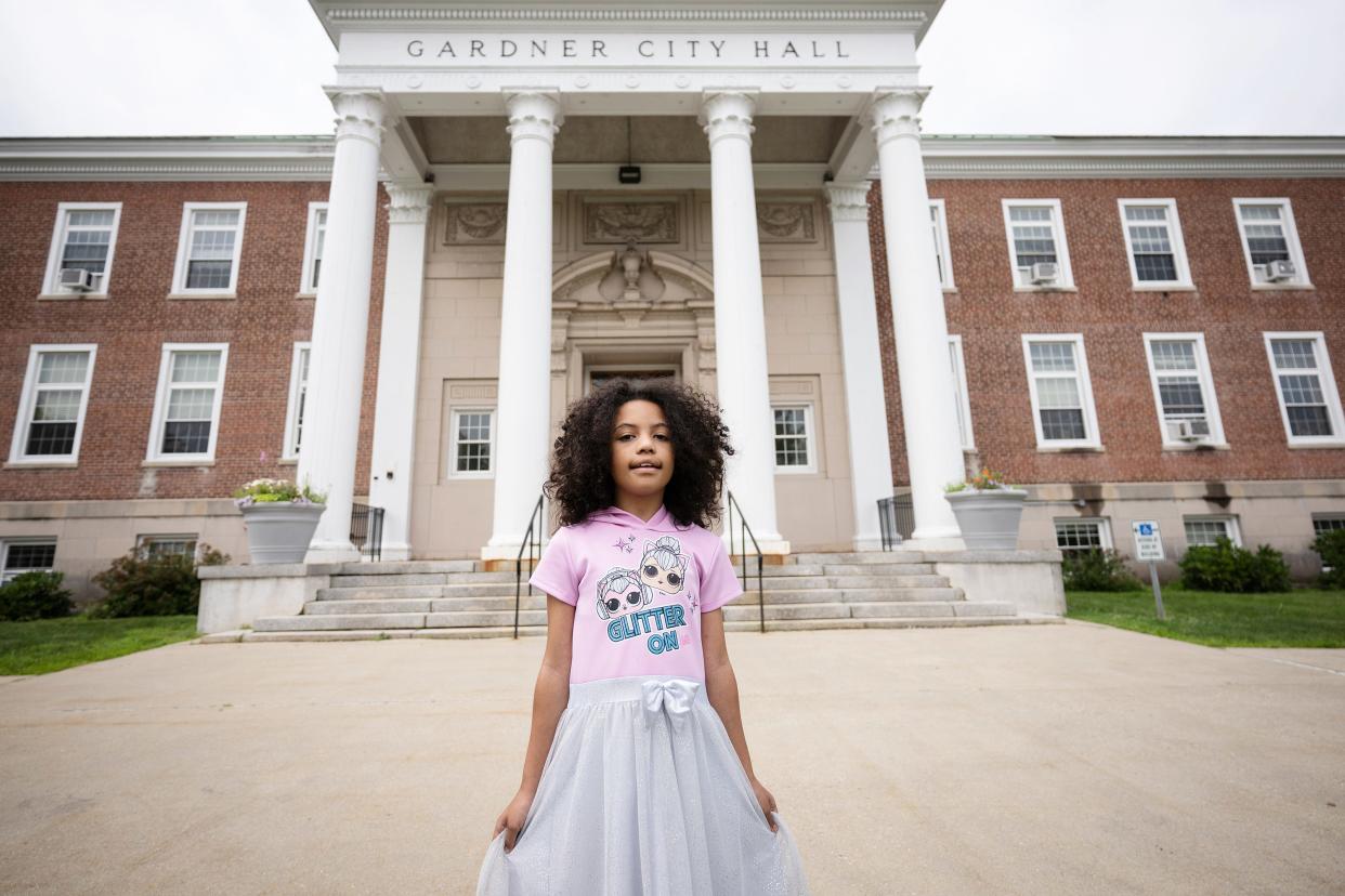 Ciara Barber, 8 of Worcester, poses in front of Gardner City Hall on Thursday.