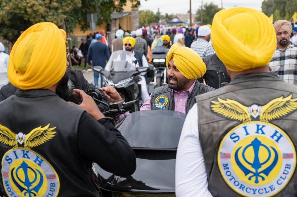 Members of the Sikh Motorcycle Club stop along the route at the Yuba City Nagar Kirtan parade on Sunday, Nov. 5, 2023.