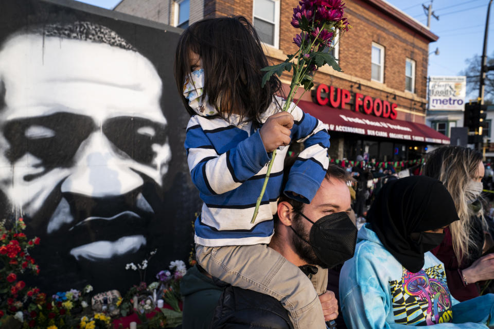 Demonstrators gather outside Cup Foods to celebrate the murder conviction of former Minneapolis police Officer Derek Chauvin in the killing of George Floyd, Tuesday, April 20, 2021, in Minneapolis. (AP Photo/John Minchillo)