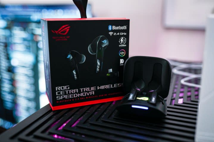 The Asus Cetra Speednova earbuds sitting with their box.