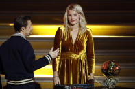 FILE - In this Monday Dec. 3, 2018 file photo, French DJ and musician Martin Solveig, left, talks to Olympique Lyonnais' Ada Hegerberg, of Norway, during the Ballon d'Or award ceremony at the Grand Palais in Paris. After asking the first woman to win the Ballon d'Or if she twerked, French DJ Martin Solveig then said sorry. UEFA launched its five-year development plan for women’s soccer Friday May 17, 2019, in a breakthrough season leading to the World Cup in France. The strategy document, Time for Action, sets out how the European soccer body aims to double the number of women and girls playing, and change perceptions of their game. (AP Photo/Christophe Ena, File)