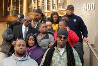 Tova Noel (C) is surrounded by fellow guards as she departs after a court hearing in New York City