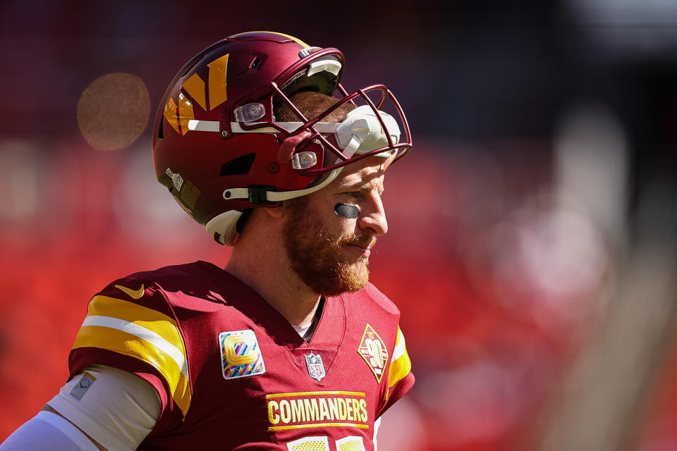 LANDOVER, MD - OCTOBER 09: Carson Wentz #11 of the Washington Commanders looks on before the game against the Tennessee Titans at FedExField on October 9, 2022 in Landover, Maryland. (Photo by Scott Taetsch/Getty Images)