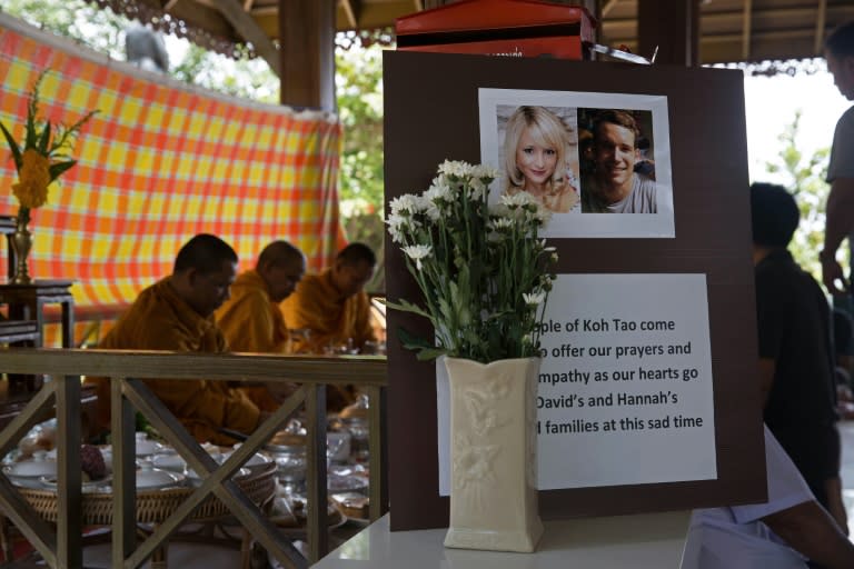 Thai Buddhist monks recite prayers during a religious ceremony held in memory of two murdered British tourists on the southern resort island of Koh Tao on September 18, 2014