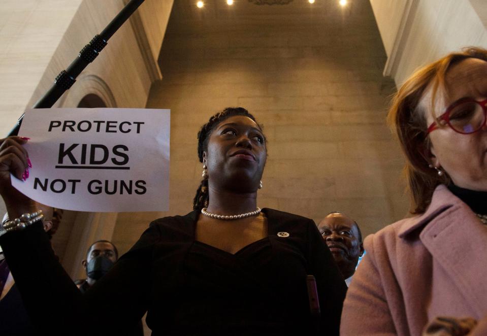 Sen. Charlane Oliver stands with protesters in the rotunda before representatives hold a House session at the State Capitol Building in Nashville , Tenn., Wednesday, March 29, 2023.