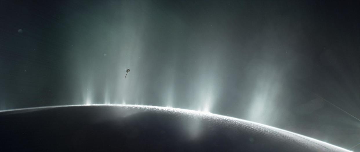 NASA's Cassini spacecraft is shown diving through the plume of Saturn's moon Enceladus, in 2015, in this photo illustration: Reuters