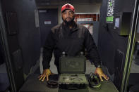 In this Sunday, Feb. 9, 2020 photo, Kevin Dixie poses for a portrait at a shooting range in Ballwin, Mo. Dixie considers himself agnostic when it comes to politics. But he's an ardent supporter of the Second Amendment who believes that gun rights are about empowering minority communities and ensuring freedom is available to every American, regardless of race, ethnicity or gender. (AP Photo/Jeff Roberson)