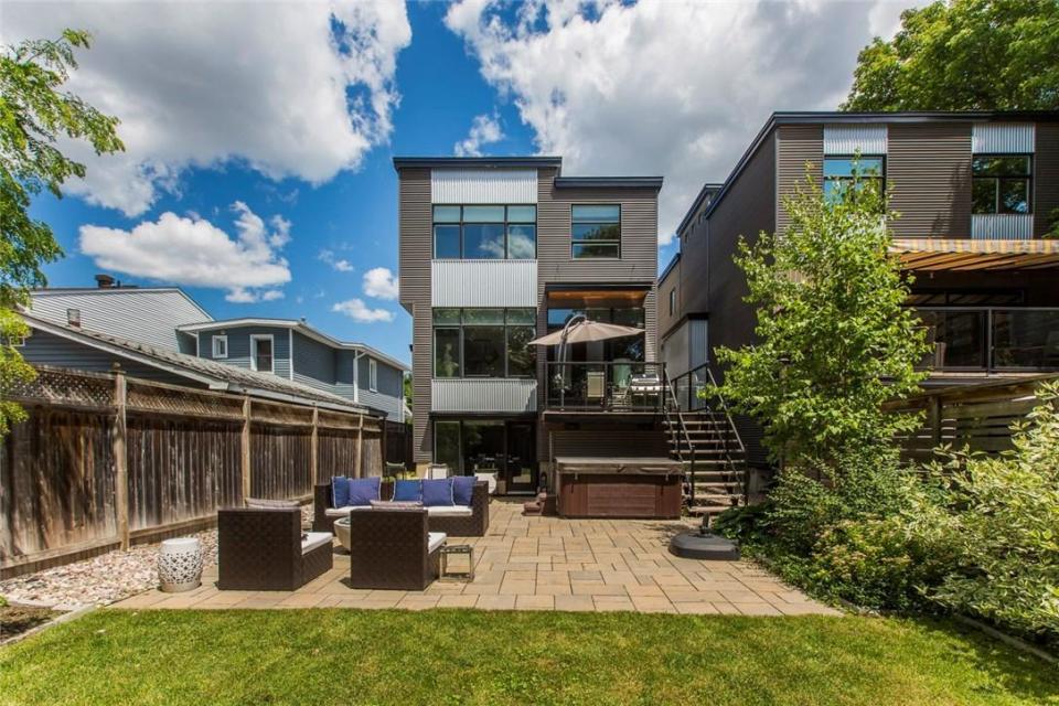 <p><span>546 Hilson Avenue, Ottawa, Ont.</span><br> Outside, the backyard is surrounded by mature trees, giving you privacy to lounge on the deck or hang out in the hot tub.<br> (Photo: Zoocasa) </p>