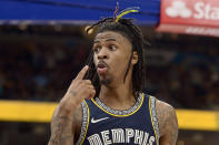 Memphis Grizzlies guard Ja Morant reacts after scoring during the second half of Game 2 of the team's second-round NBA basketball playoff series against the Golden State Warriors on Tuesday, May 3, 2022, in Memphis, Tenn. The Grizzlies won 106-101. (AP Photo/Brandon Dill)