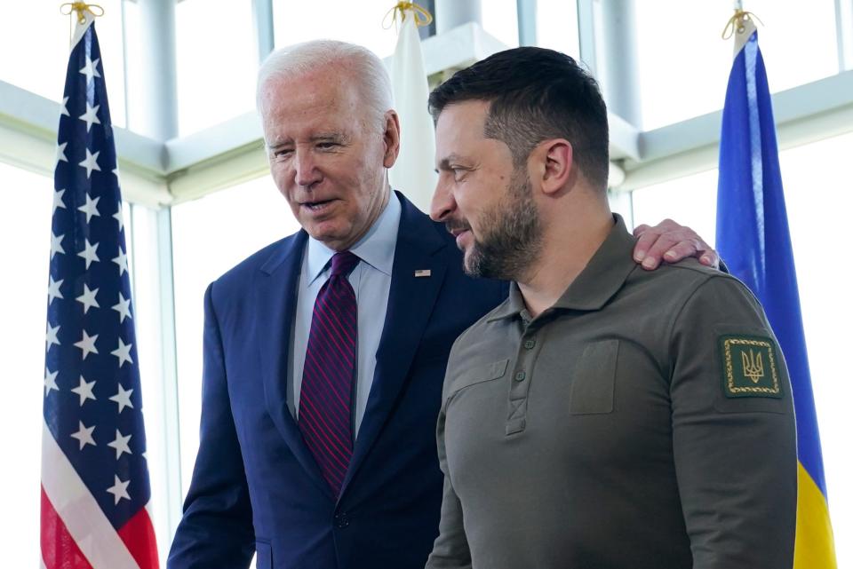 President Joe Biden, left, walks with Ukrainian President Volodymyr Zelenskyy ahead of a working session on Ukraine during the G7 Summit in Hiroshima, Japan, Sunday, May 21, 2023.