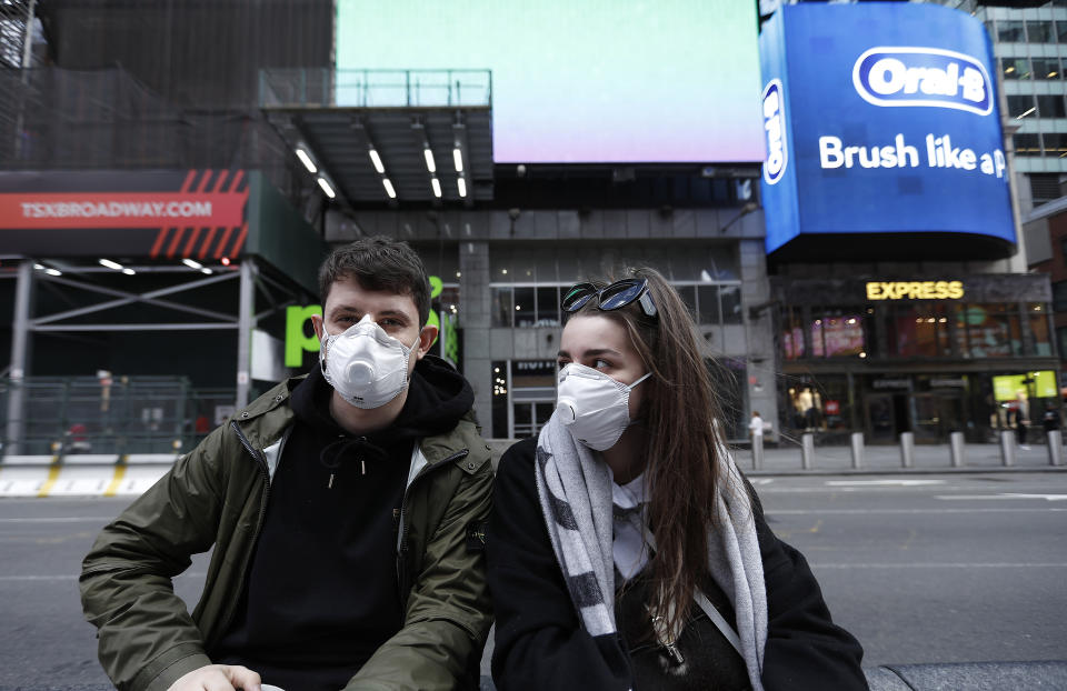  Visitors to the theatre district wear face masks as a precaution against the spread of Coronavirus at the Times Square. Amid the COVID19 (coronavirus) concerns and a ban on groups of 500 of people, a directive issued by New York State Andrew Cuomo, all of Broadway performances have been closed until April 12, 2020. President Charlotte St. Martin of the Broadway League issued statement stating that Broadway is committed to enrich and foster enrichment and to inspire all the while entertain its visitors. Additionally, the league is committed to protect all those who work in the industry. (Photo by John Lamparski / SOPA Images/Sipa USA) 