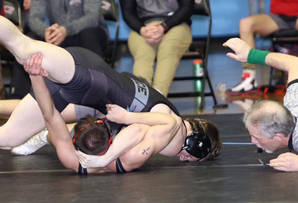 Alliance's Tomas Simmons, top, and Salem's Caleb Shafer during their 150-pound match at Alliance High School Thursday, January 27, 2022.