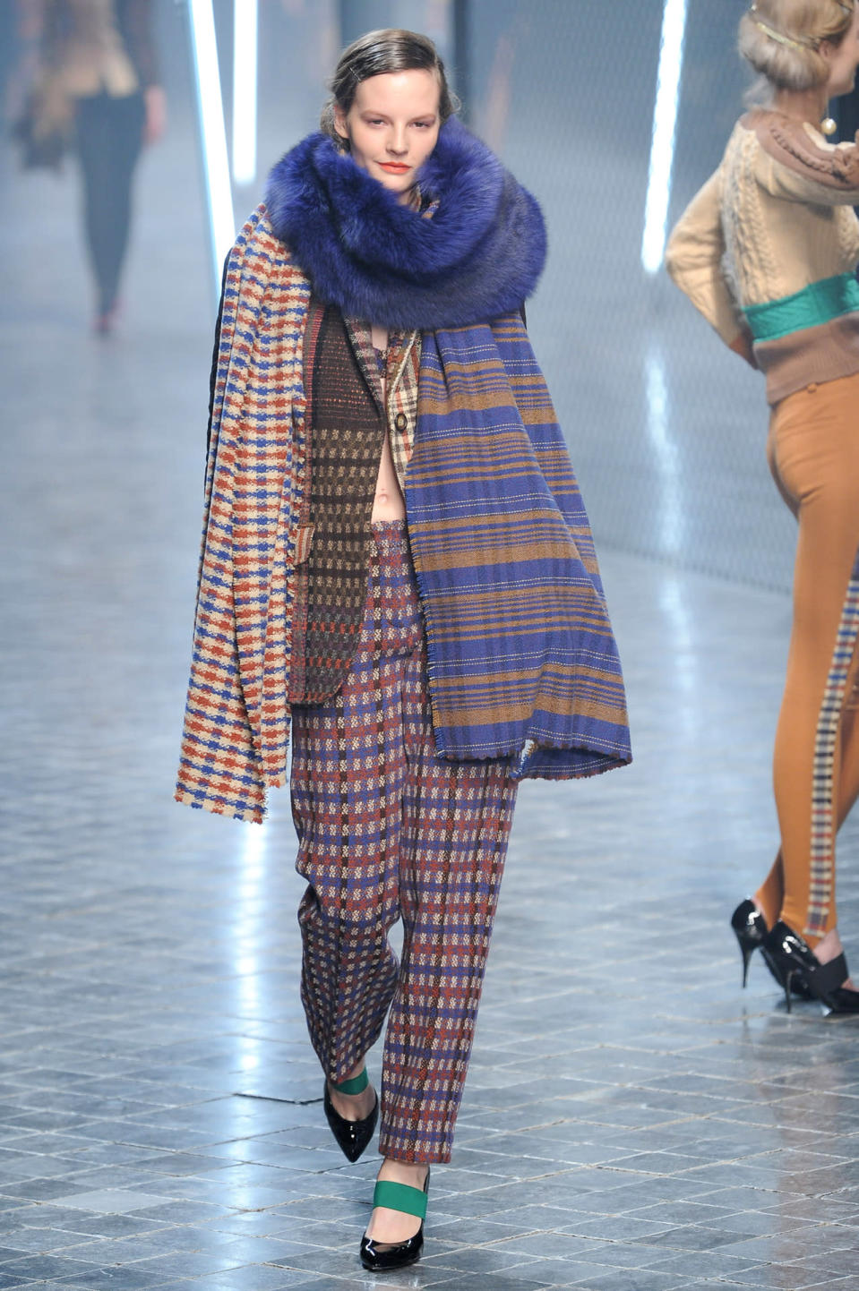 A model wears a mismatched, checked-and-striped suit at the fall 2011 Sonia Rykiel fashion show in Paris.