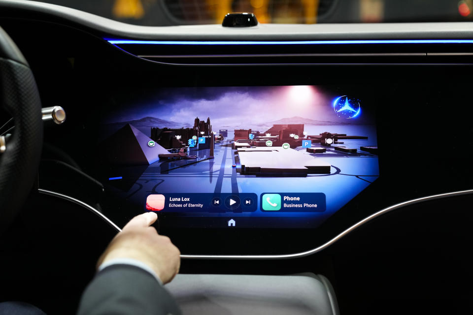 Vadim Weiss, Mercedes-Benz USA, gives a demonstration of the company's new operating system, MBOS 1, during the CES tech show Tuesday, Jan. 9, 2024, in Las Vegas. (AP Photo/Ryan Sun)