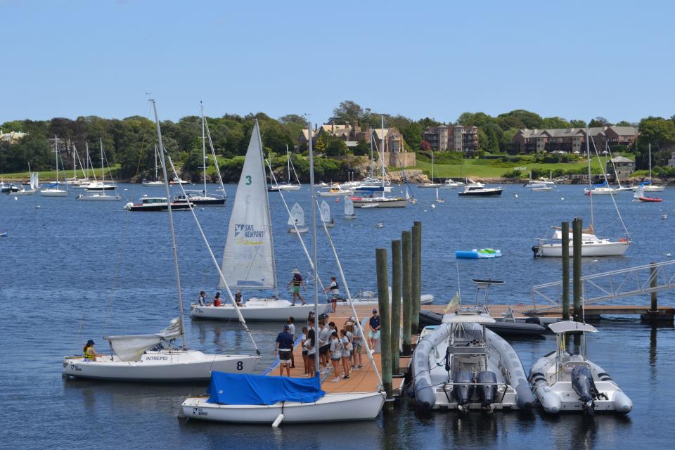 Gold Star Sailing campers learn about the different components of Sail Newport's J22 fleet on the dock at Newport's Fort Adams State Park on Monday, July 31 2023.