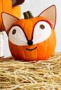 <p>You don't need to be sly as a fox recreate this friendly fur critter. <br></p><p><strong>Make the pumpkin:</strong> Using this image as a guide, outline the face silhouette with pencil first. For the pupils, hot-glue black and orange yarn in a spiral pattern directly onto the pumpkin. Hot-glue a continuous piece of white yarn in a teardop pattern until the space is fully filled. Outline the eyes with rust yarn, then add a black yarn mouth and pom-pom nose. For ears, glue felt on cover-weight paper backing. Cut into triangles, trim with rust yarn, and glue to the top of the pumpkin. </p>