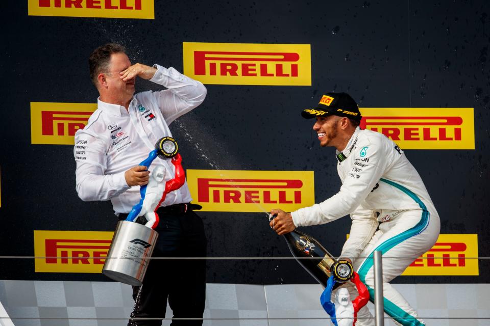 Spray it again: Lewis Hamilton drenches Mercedes AMG Sporting Director Ron Meadows on the Paul Ricard podium